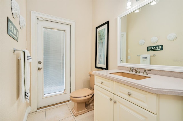 4427 S Atlantic Ave, Port Orange, FL 32127 - bathroom with toilet, vanity, and tile patterned flooring