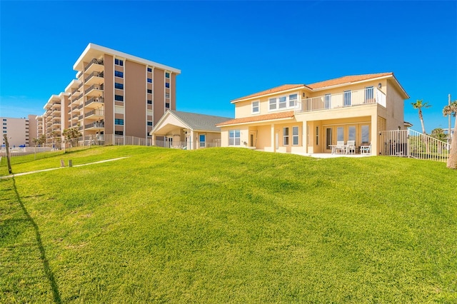 4427 S Atlantic Ave, Port Orange, FL 32127 - back of house with a balcony and a patio area