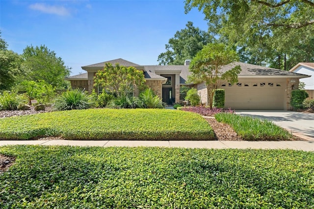 1637 Bent Oaks Blvd, Deland, FL 32724 - view of front of home with an attached garage, concrete driveway, and roof with shingles