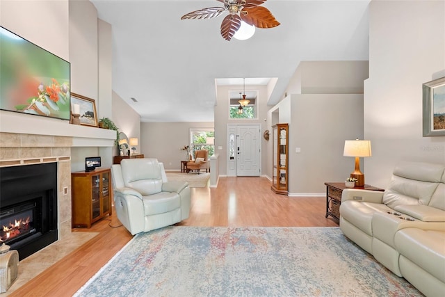 1637 Bent Oaks Blvd, Deland, FL 32724 - living area with ceiling fan, a fireplace with flush hearth, wood finished floors, and baseboards