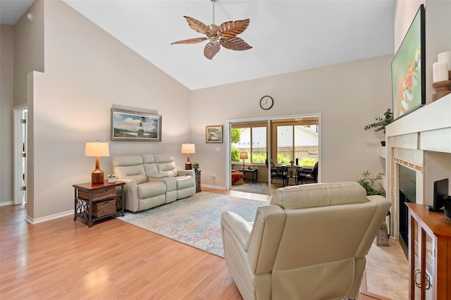 1637 Bent Oaks Blvd, Deland, FL 32724 - living area featuring high vaulted ceiling, a ceiling fan, light wood-type flooring, baseboards, and a fireplace