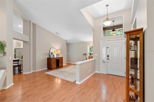 1637 Bent Oaks Blvd, Deland, FL 32724 - entrance foyer featuring light wood-style floors, high vaulted ceiling, and baseboards