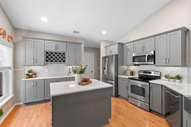 1637 Bent Oaks Blvd, Deland, FL 32724 - kitchen with appliances with stainless steel finishes, gray cabinets, light countertops, tasteful backsplash, and recessed lighting