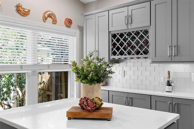 1637 Bent Oaks Blvd, Deland, FL 32724 - kitchen with gray cabinets, light countertops, and backsplash