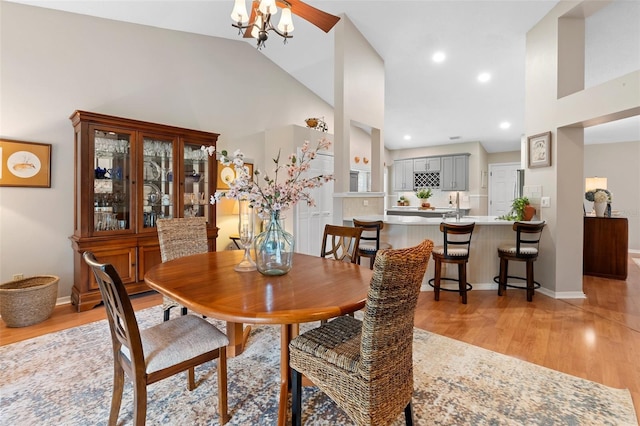 1637 Bent Oaks Blvd, Deland, FL 32724 - dining area with light wood-style flooring, high vaulted ceiling, baseboards, and recessed lighting