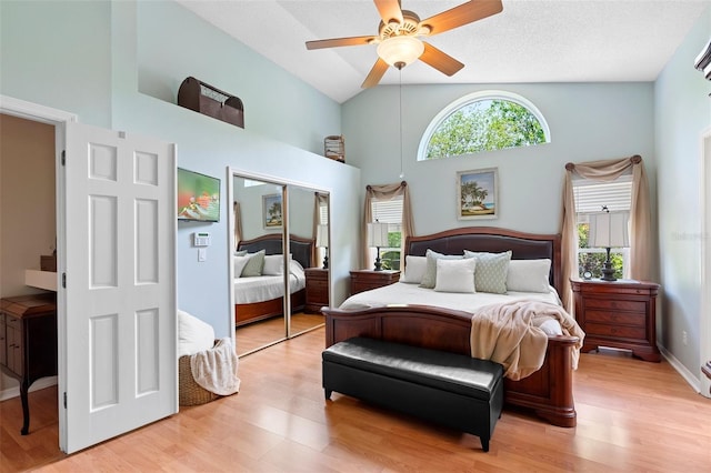 1637 Bent Oaks Blvd, Deland, FL 32724 - bedroom with high vaulted ceiling, a closet, multiple windows, light wood-type flooring, and ceiling fan