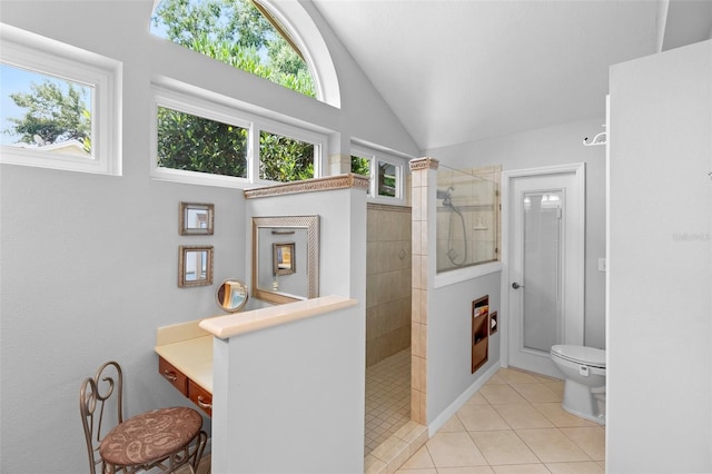 1637 Bent Oaks Blvd, Deland, FL 32724 - full bath featuring walk in shower, tile patterned flooring, toilet, vanity, and high vaulted ceiling