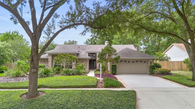 1637 Bent Oaks Blvd, Deland, FL 32724 - single story home featuring an attached garage, driveway, a chimney, and roof with shingles