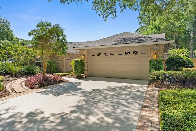 1637 Bent Oaks Blvd, Deland, FL 32724 - view of front of home with brick siding, driveway, a shingled roof, and a garage