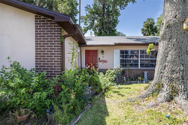 5 Greenfern Cir, Ormond Beach, FL 32174 - entrance to property with brick siding and stucco siding