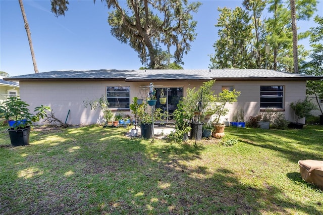 5 Greenfern Cir, Ormond Beach, FL 32174 - back of house featuring a lawn