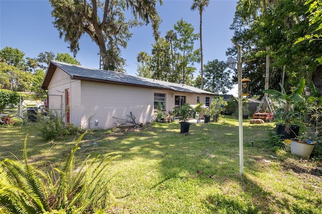 5 Greenfern Cir, Ormond Beach, FL 32174 - back of property featuring concrete block siding