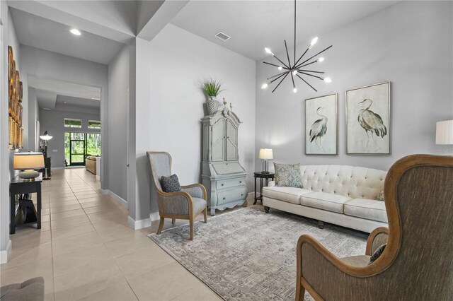 344 Stirling Bridge Dr, Ormond Beach, FL 32174 - living area with light tile patterned floors, a chandelier, and baseboards