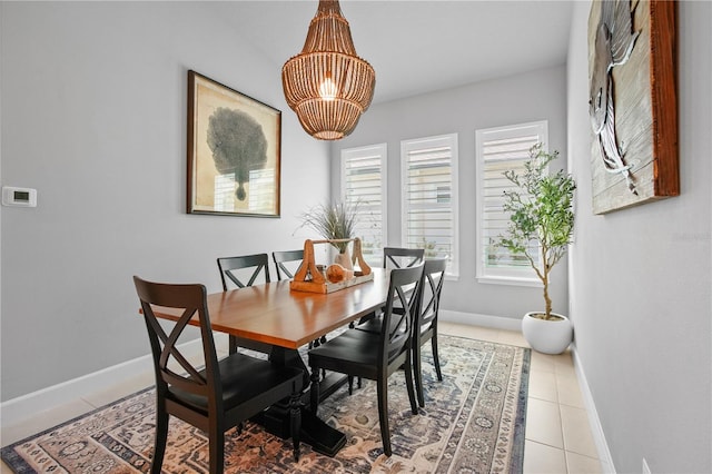 344 Stirling Bridge Dr, Ormond Beach, FL 32174 - dining space with baseboards, a chandelier, and light tile patterned floors