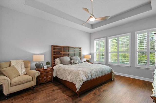 344 Stirling Bridge Dr, Ormond Beach, FL 32174 - bedroom with a raised ceiling, dark wood-style flooring, baseboards, and ceiling fan
