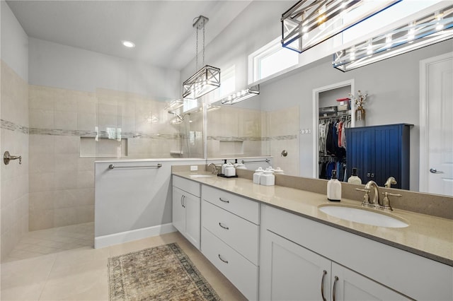 344 Stirling Bridge Dr, Ormond Beach, FL 32174 - full bath with walk in shower, double vanity, a walk in closet, tile patterned flooring, and recessed lighting
