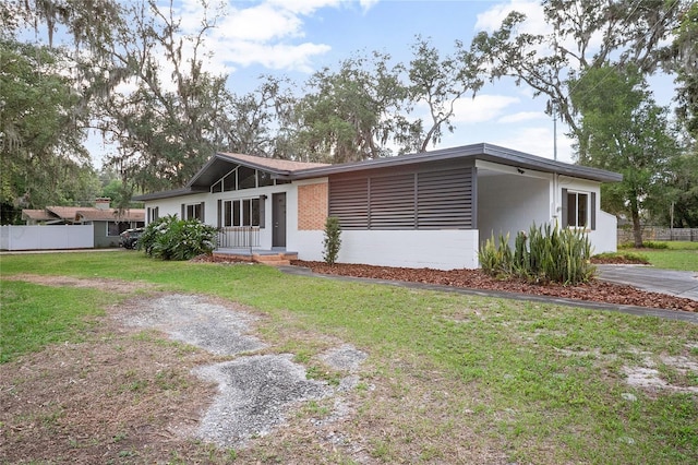 2215 Lake Ruby Rd, Deland, FL 32724 - mid-century inspired home with a carport