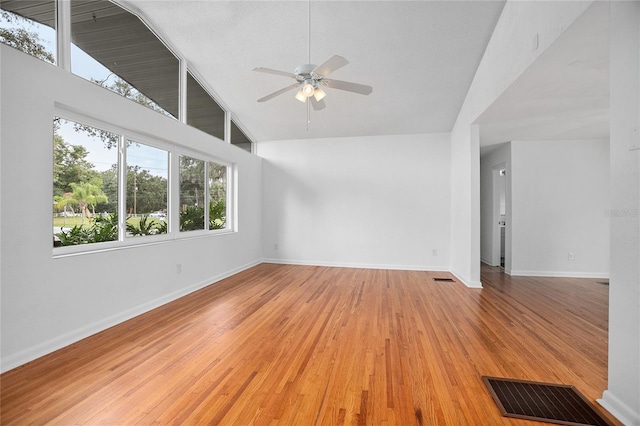 2215 Lake Ruby Rd, Deland, FL 32724 - unfurnished room with high vaulted ceiling, a ceiling fan, light wood finished floors, and baseboards