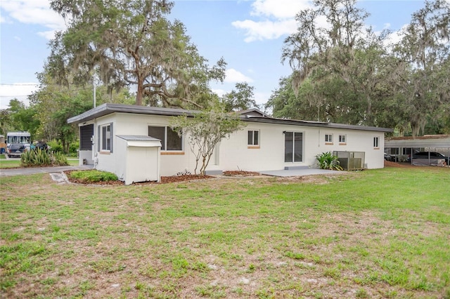 2215 Lake Ruby Rd, Deland, FL 32724 - back of house with a yard and central air condition unit