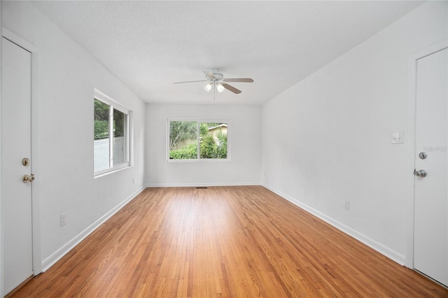2215 Lake Ruby Rd, Deland, FL 32724 - unfurnished room featuring ceiling fan, light wood-style floors, and baseboards