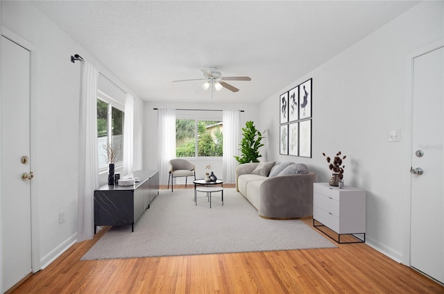2215 Lake Ruby Rd, Deland, FL 32724 - living area featuring ceiling fan, light wood-style flooring, and baseboards