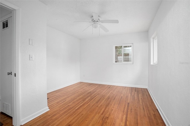 2215 Lake Ruby Rd, Deland, FL 32724 - spare room with wood finished floors, a ceiling fan, and baseboards