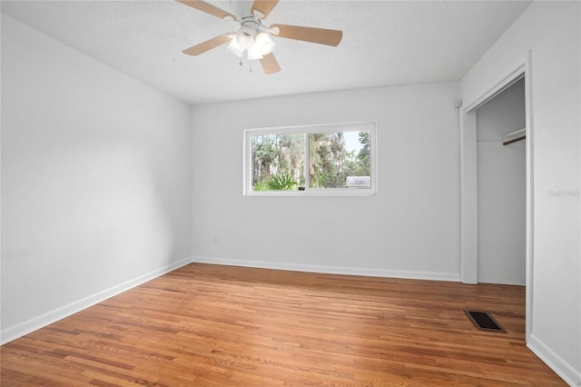 2215 Lake Ruby Rd, Deland, FL 32724 - unfurnished bedroom featuring light wood-style floors, baseboards, ceiling fan, and a closet