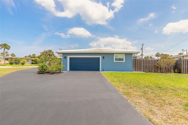 1032 Bel Aire Dr, Daytona Beach, FL 32118 - view of front of home featuring stucco siding, asphalt driveway, an attached garage, and a tile roof