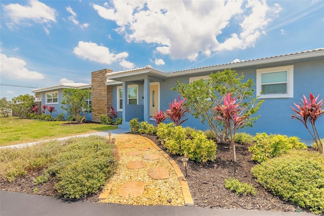 1032 Bel Aire Dr, Daytona Beach, FL 32118 - view of front of property with a front lawn and a porch