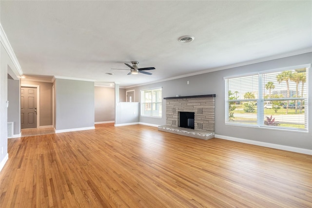 1032 Bel Aire Dr, Daytona Beach, FL 32118 - unfurnished living room with crown molding, baseboards, a fireplace, ceiling fan, and light wood-style floors