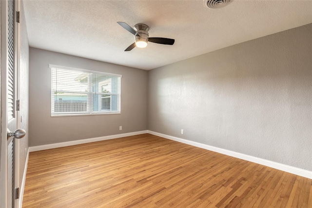 1032 Bel Aire Dr, Daytona Beach, FL 32118 - spare room featuring light wood finished floors, baseboards, a ceiling fan, and a textured ceiling