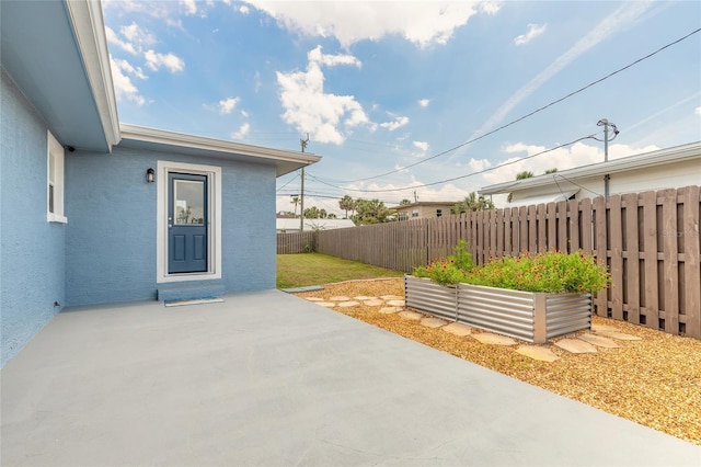 1032 Bel Aire Dr, Daytona Beach, FL 32118 - fenced backyard with a patio