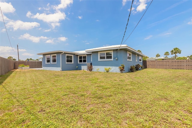 1032 Bel Aire Dr, Daytona Beach, FL 32118 - rear view of house with stucco siding