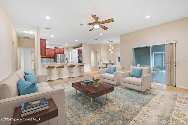 675 Easton Forest Cir SE, Palm Bay, FL 32909 - living area featuring ceiling fan, recessed lighting, baseboards, and light wood-type flooring
