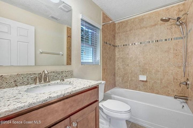 675 Easton Forest Cir SE, Palm Bay, FL 32909 - bathroom featuring toilet, vanity, bathtub / shower combination, a textured ceiling, and tile patterned floors