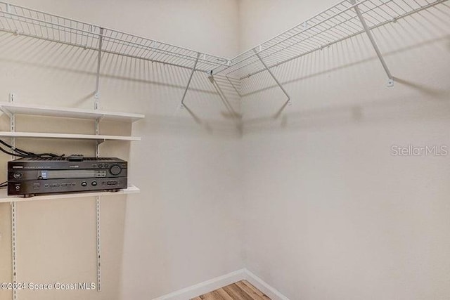 675 Easton Forest Cir SE, Palm Bay, FL 32909 - walk in closet featuring wood finished floors