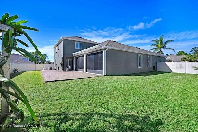 675 Easton Forest Cir SE, Palm Bay, FL 32909 - back of property featuring stucco siding, a patio area, a sunroom, and an attached garage