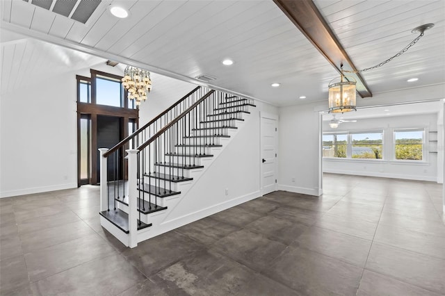 604 Springdale Dr, Flagler Beach, FL 32136 - stairway with a chandelier, recessed lighting, and baseboards