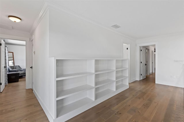 604 Springdale Dr, Flagler Beach, FL 32136 - hallway with ornamental molding, wood finished floors, and baseboards