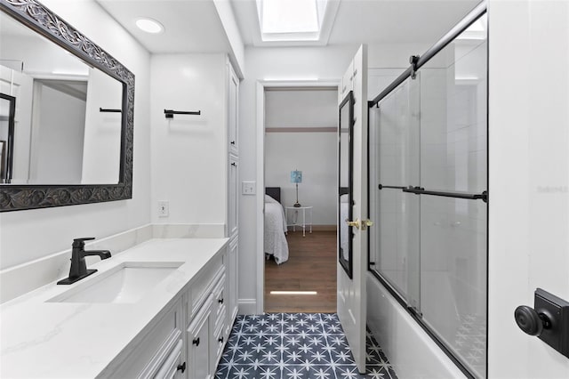 604 Springdale Dr, Flagler Beach, FL 32136 - ensuite bathroom with vanity and combined bath / shower with glass door
