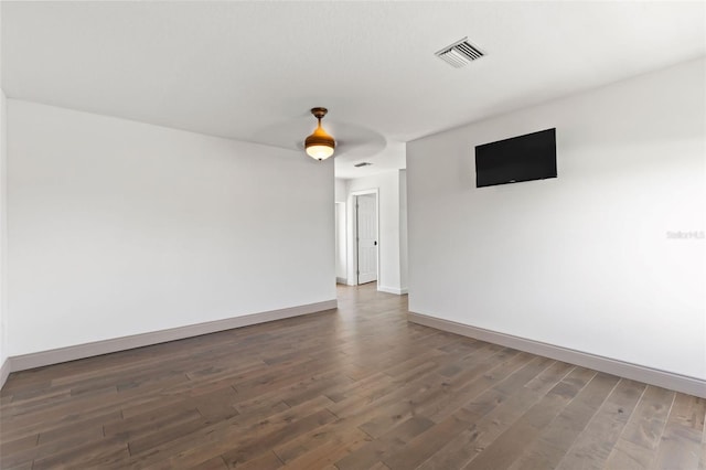 604 Springdale Dr, Flagler Beach, FL 32136 - unfurnished room with baseboards and wood finished floors