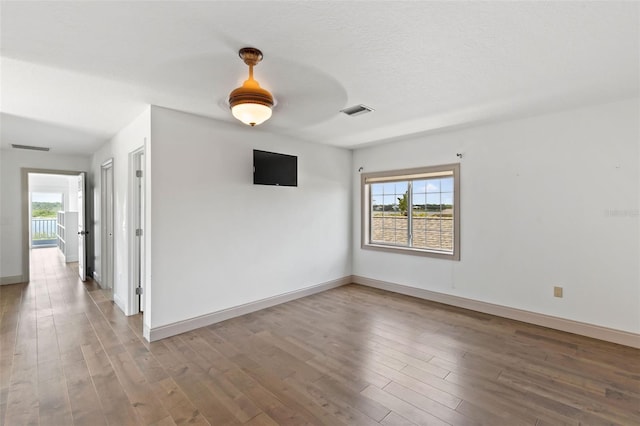 604 Springdale Dr, Flagler Beach, FL 32136 - spare room with wood finished floors and baseboards