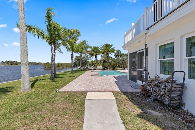 604 Springdale Dr, Flagler Beach, FL 32136 - swimming pool featuring a patio area, a water view, and a yard