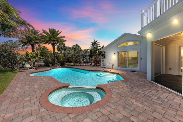 604 Springdale Dr, Flagler Beach, FL 32136 - pool at dusk with a patio area and a pool with connected hot tub