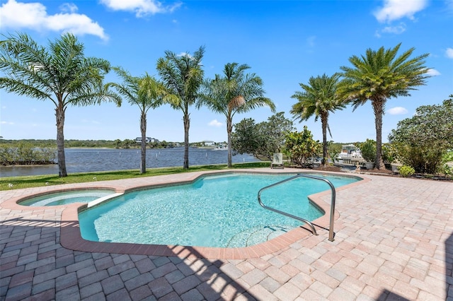 604 Springdale Dr, Flagler Beach, FL 32136 - view of pool with a patio area, a pool with connected hot tub, and a water view