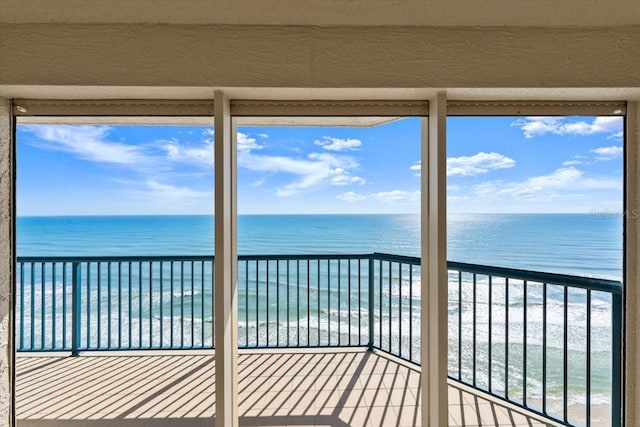 3425 S Atlantic Ave Unit 1602, Daytona Beach, FL 32118 - unfurnished sunroom featuring view of water and beach