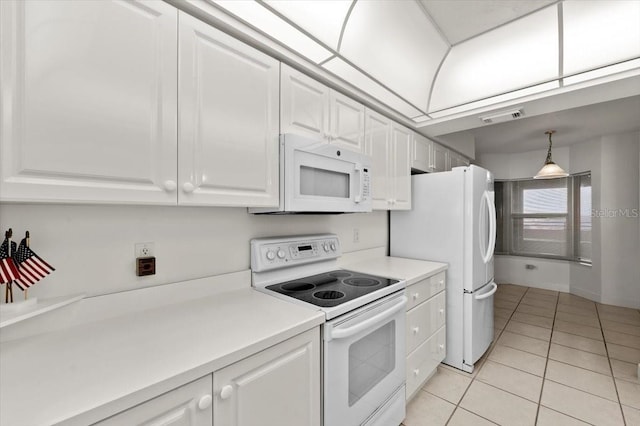 3425 S Atlantic Ave Unit 1602, Daytona Beach, FL 32118 - kitchen featuring white appliances, light tile patterned floors, white cabinetry, and light countertops