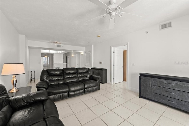 3425 S Atlantic Ave Unit 1602, Daytona Beach, FL 32118 - living area with light tile patterned floors, a ceiling fan, and baseboards