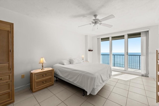 3425 S Atlantic Ave Unit 1602, Daytona Beach, FL 32118 - bedroom with a water view, access to outside, light tile patterned floors, and a ceiling fan