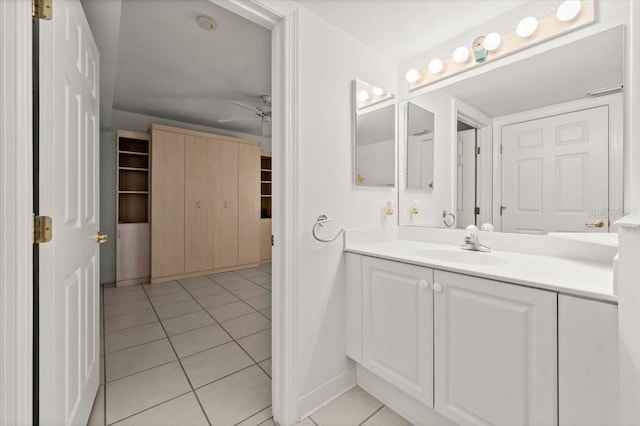 3425 S Atlantic Ave Unit 1602, Daytona Beach, FL 32118 - bathroom featuring vanity, tile patterned flooring, ceiling fan, and baseboards